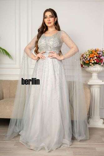 فستان سهرة مميز بتطريز من خامة التل الامع بأكمام ك...