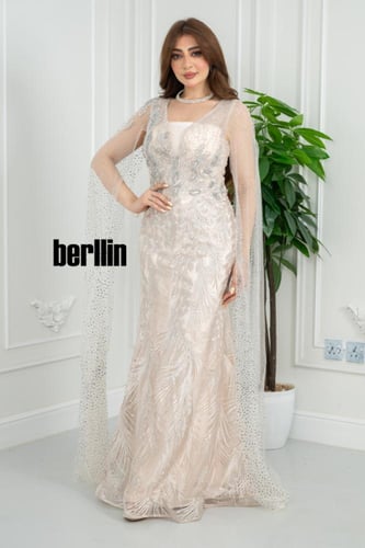 فستان سهره شامبانيا مائي بقصّة حورية تطريز ريش لام...