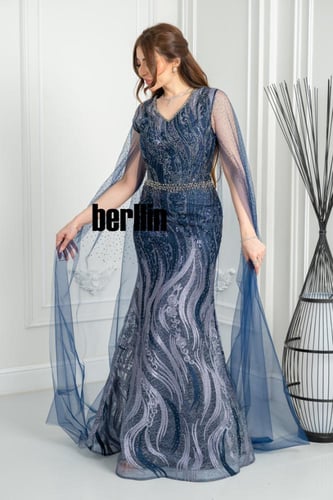 فستان سهرة أزرق ملكي مطرّز بتفاصيل براقة وأكمام شف...