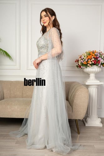 فستان سهرة مميز بتطريز من خامة التل الامع بأكمام ك...