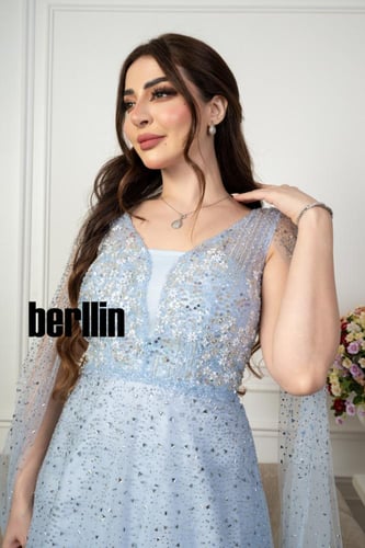 فستان سهرة مميز بتطريز من خامة التل الامع بأكمام ك...