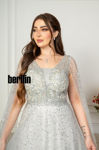 فستان سهرة مميز بتطريز من خامة التل الامع بأكمام ك...