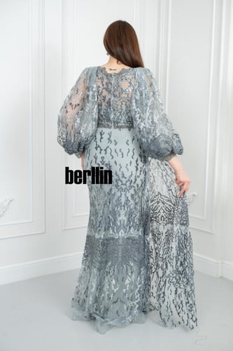 فستان سهرة أنيق بتصميم يتميز بتطريز فاخر مع أكمام...