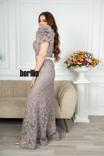 فستان سهرة طويل تل مطرز بستايل أكمام بف منفوخ لون...