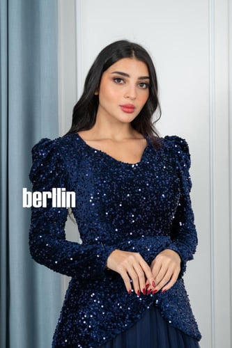 فستان سهرة طويل ترتر مميز بقصة كلوش تل لون كحلي