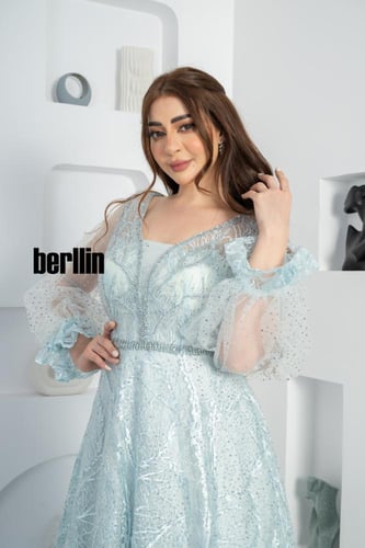 فستان سهرة ماكسي مميز بكم بف وبقصة واسعة لون سماوي