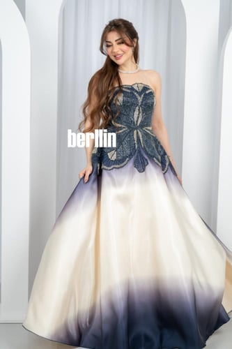 فستان سهرة الأومبري الكحلي والعاجي بتطريز أوراق لا...