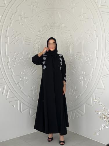 Black crepe abaya with white hand embroidery, flar...