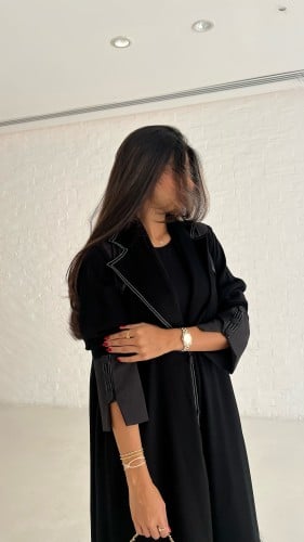 Black royal crepe abaya with white dots all over t...