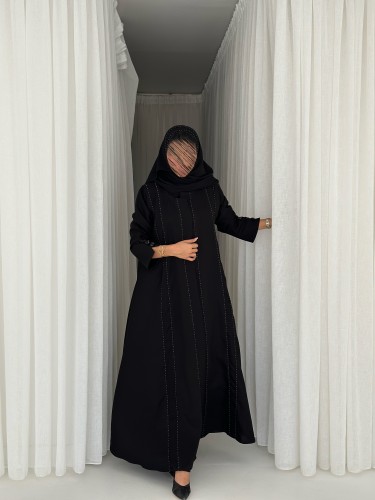 Black crepe abaya with embroidered belt across the...