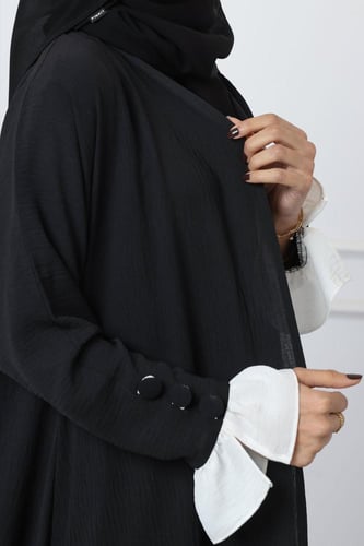 عباية كريب أمريكي كلوش وأكمام بيضاء بأزرار