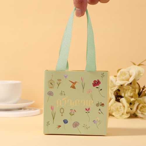 أكياس توزيعات العيد "عاد عيدكم" لون تفاحي-(12)حبة...