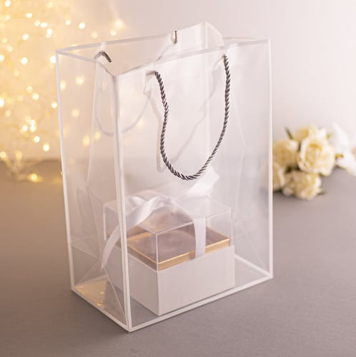 مجموعة (12) كيس بلاستيك شفاف للهدايا باطار أبيض