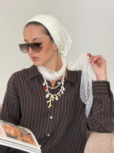 Turban bin Tul beige dotted worn in multiple ways