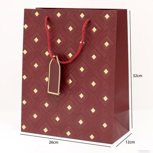 أكياس هدايا مزخرفة بنقاط ذهبية