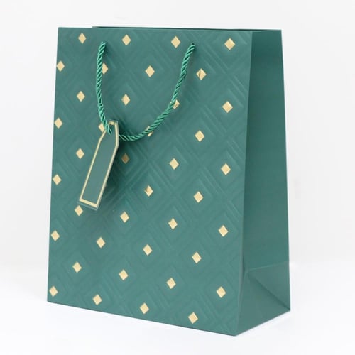 أكياس هدايا مزخرفة بنقاط ذهبية