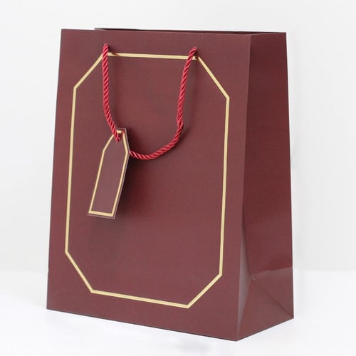 أكياس هدايا بإطار ذهبي