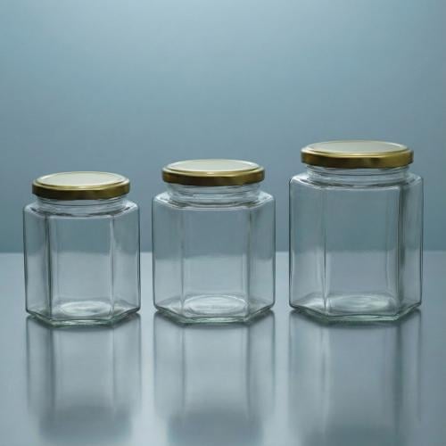 برطمان عسل زجاج سداسي