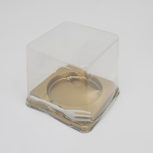 علب كيك بلاستيك بقاعدة ذهبية مزودة بشوكة