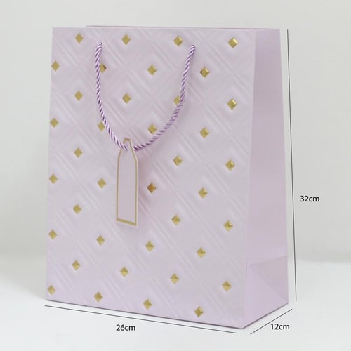 أكياس هدايا مزخرفة بنقاط ذهبية