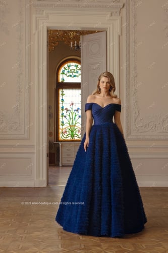‏ Off-shoulder gown with ruffle skirt