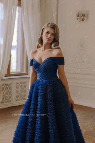 ‏ Off-shoulder gown with ruffle skirt