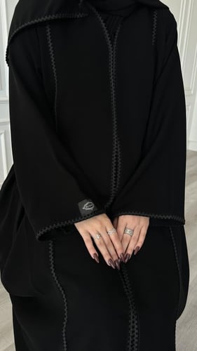 عباية كلوش قماش(سراميك)بكلفة اسود وكسرات من الجوان...