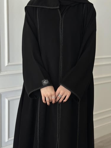 عباية كلوش قماش(سراميك)بكلفة اسود وكسرات من الجوان...