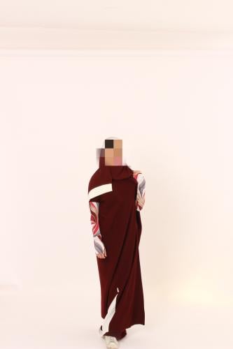 Burgundy abaya with colorful sleeves.