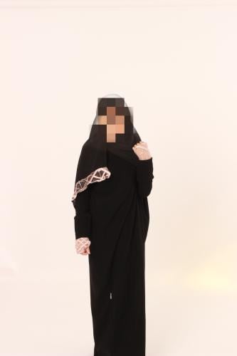 Black abaya with pink details.
