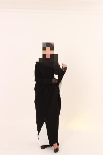 Black abaya with a white hem.