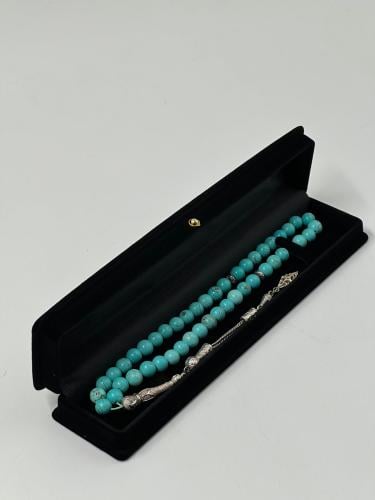 كبس حجر باللون الفيروزي