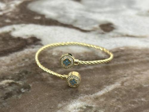 اسورة يد ذهبية بوردة زرقاء