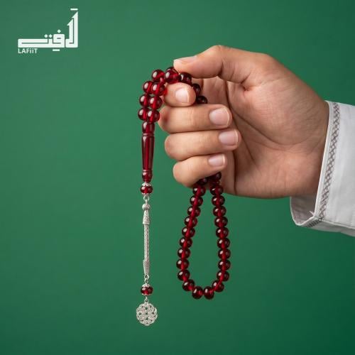 Red ruby prayer bead with silver tassel