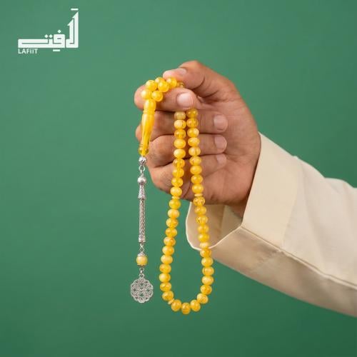 Golden yellow prayer bead with silver tassel