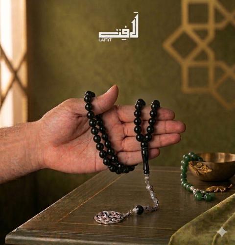 Black prayer bead string with silver tassel