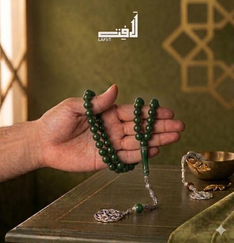 Green prayer bead with silver tassel