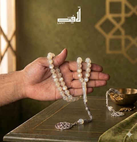 White pearl rosary with silver tassel