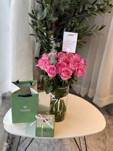 Vase of flowers with Patchi chocolate