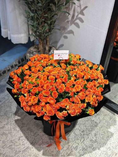A large orange bouquet facing