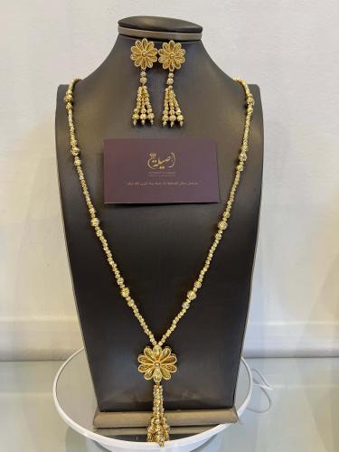 سبح دوريكا ذهبية مع وردة