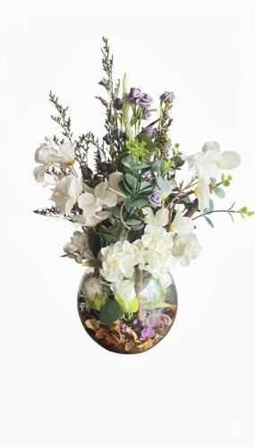 Luxury artificial flower arrangement inside a tran...