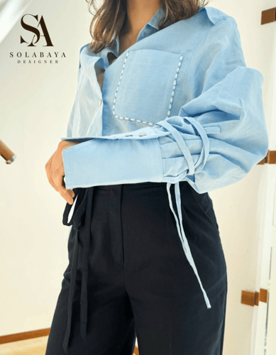 طقم نسائي أنيق مكون من قميص واسع وبنطال فضفاض