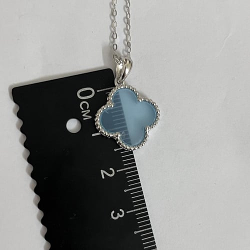 نصف طقم فان كليف صدف *سماوي* وردة كبيرة