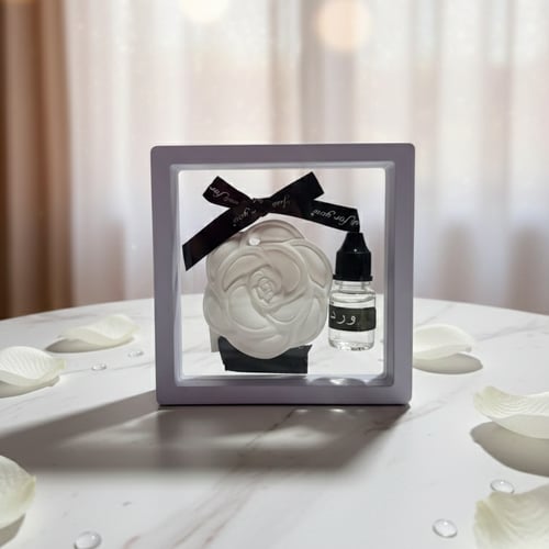 Arrangement of flowers and perfume