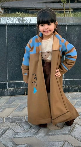 فروه شتوي أنيق للأطفال بتصميم يجمع بين الدفء واللم...