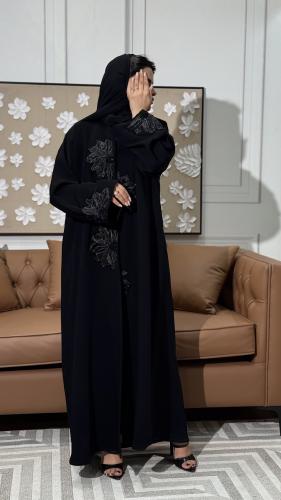 An attractive abaya made of heavy ceramic fabric, with a semi-umbrella design