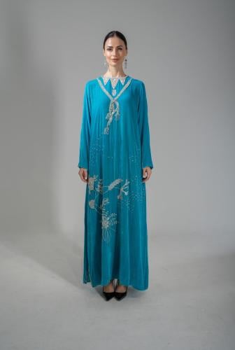 Velvet turquoise dress decorated with crystals