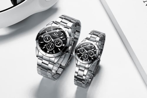 طقم ساعات الزوجين رجالية ونسائية باللون الفضي والأ...