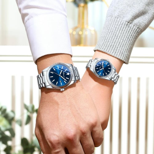 طقم مكون من ساعتين رجالية ونسائية باللون الفضي وال...